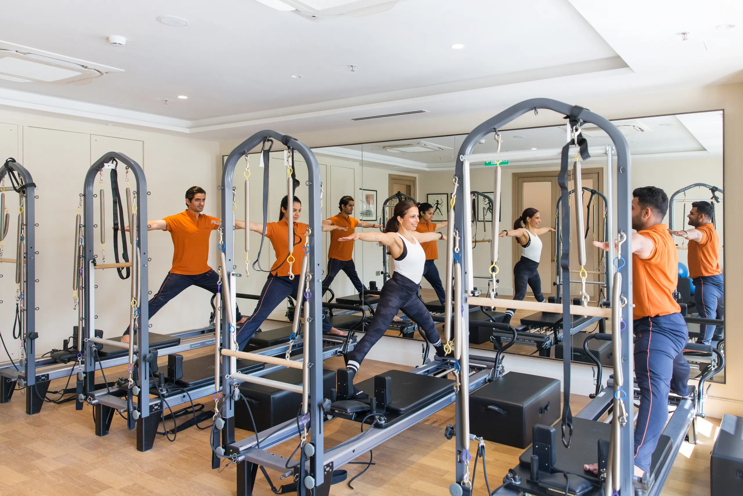 Members in a Pilates reformer class at DLF THRIVE Club 4