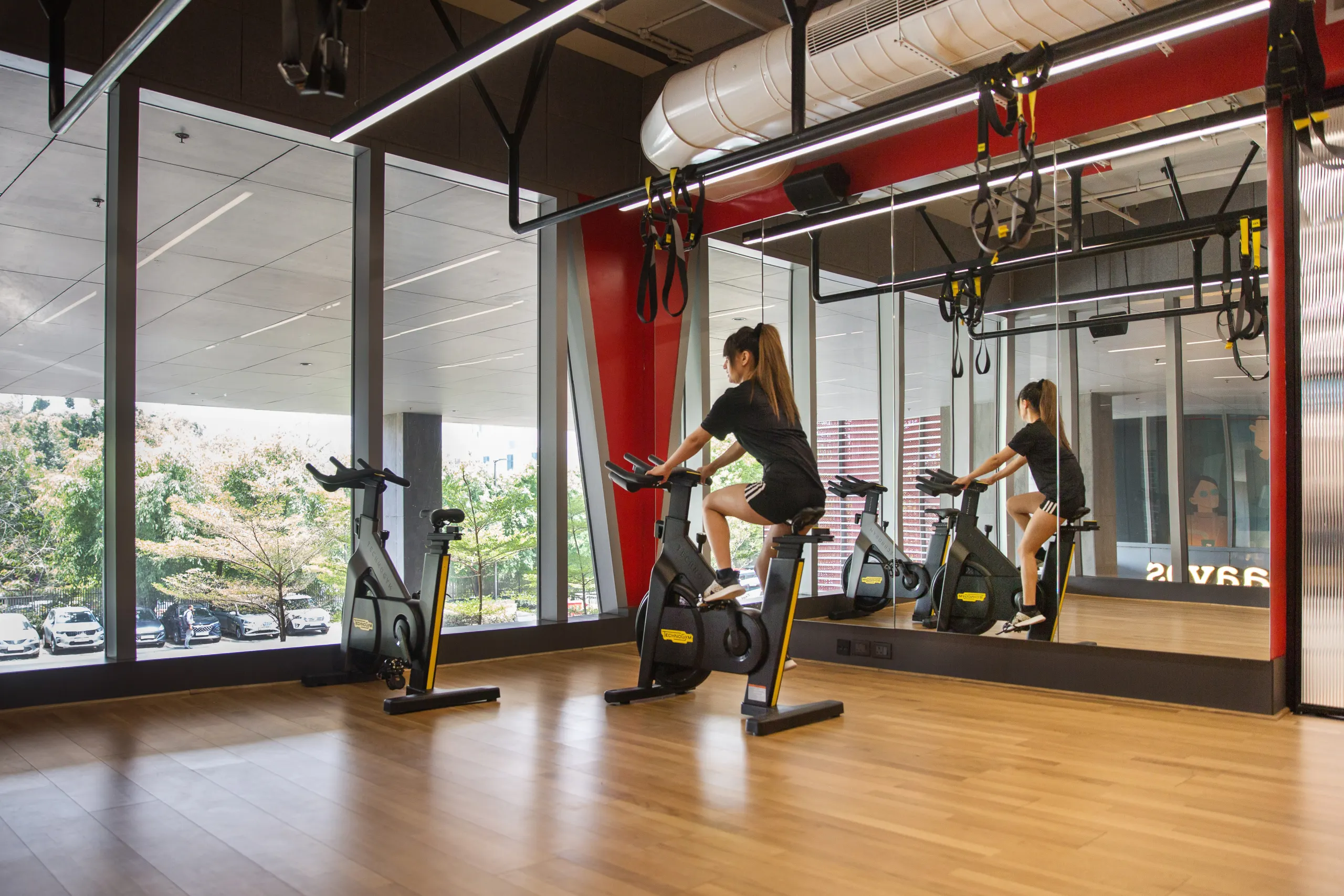 Member using the cycle studio at DLF THRIVE Gurugram